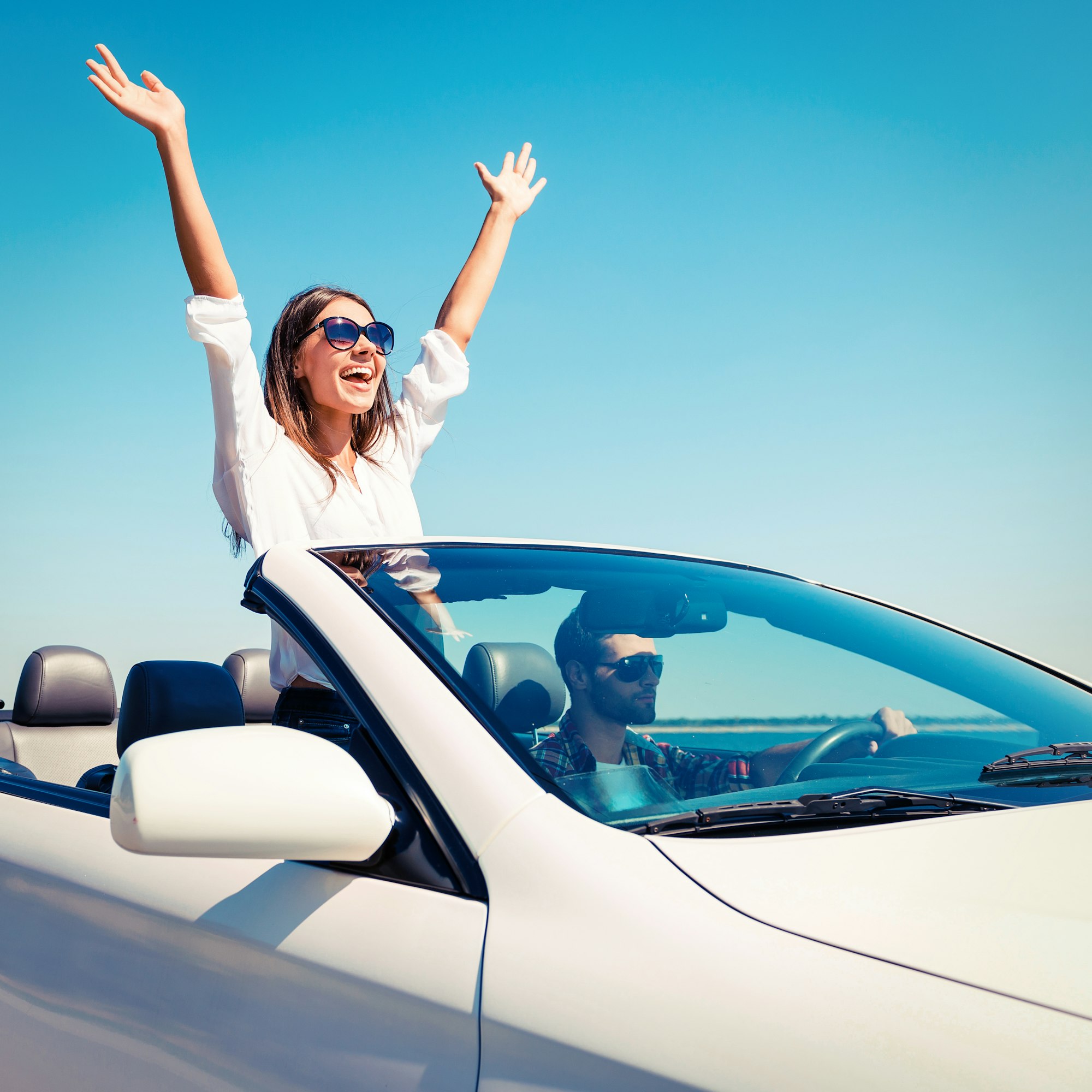 Couple in convertible.